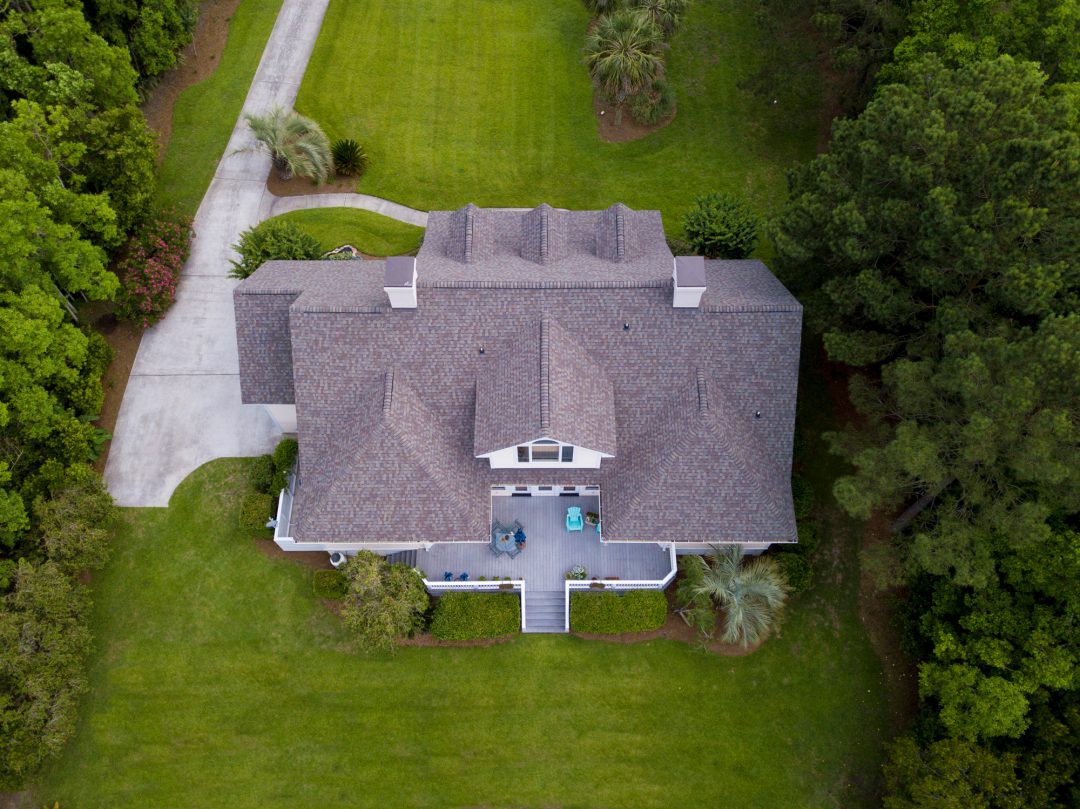 aerial view of a residential home with asphalt shingles